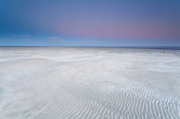 Fototapeta na wymiar sand beach on North sea at sunrise