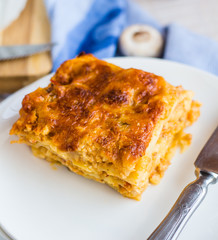 piece of meat lasagna with mushrooms, Italian cuisine