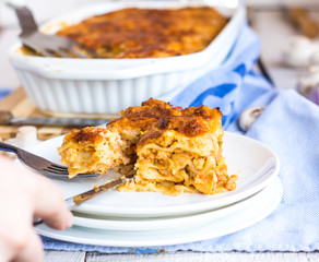 processes food meat lasagna, hands, Italian food
