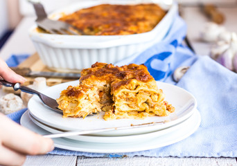 processes food meat lasagna on a white bowl, .Italian food