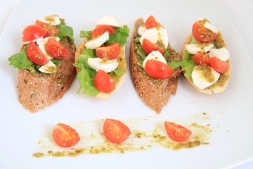 tapas with mozzarella and  cherry tomatoes