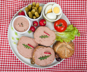 slices of bread with home made pate, vegetables and eggs