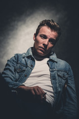 Obraz premium Cigarette smoking retro fifties cool rebellion fashion man weari