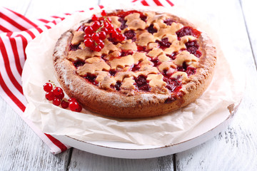 Tasty cake with berries on table close-up