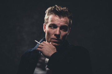 Cigarette smoking retro fifties cool rebellion fashion man weari