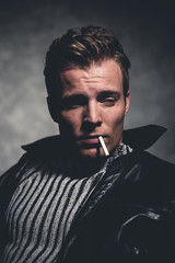Cigarette smoking retro fifties cool rebellion fashion man weari