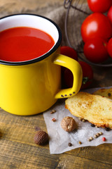 Homemade tomato juice in color mug, toasts and fresh tomatoes