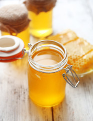 Fresh honey on wooden table