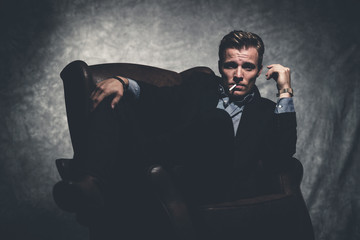 Cigarette smoking retro fifties cool business fashion man wearin