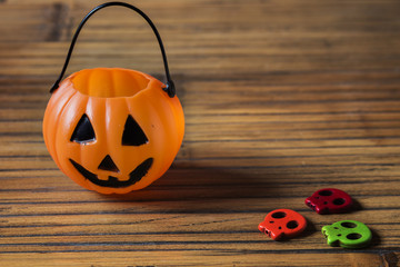 Halloween pumpkin on wooden with ghosts