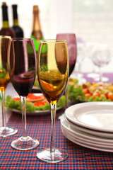 Buffet table with dishware waiting for guests