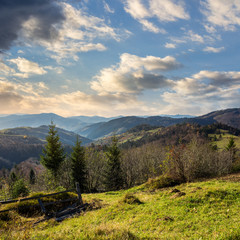 fence on hillside meadow in mountain