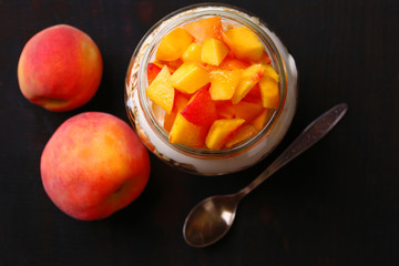 Healthy breakfast - yogurt with  fresh peach and muesli served