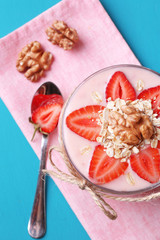 Healthy breakfast - yogurt with  strawberries and muesli served