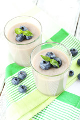 Delicious berry mousse in glasses on table close-up