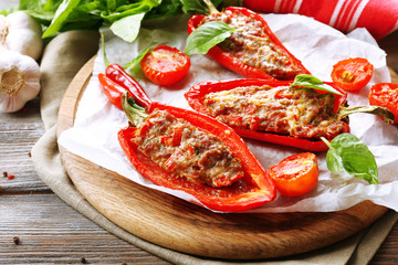 Delicious stuffed peppers on table close-up