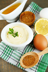 Mayonnaise ingredients on wooden background