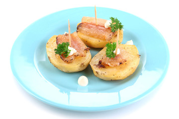 Baked potato with bacon on plate, isolated on white
