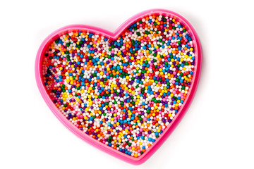 Colorful Candy sprinkles heart shape isolated