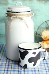Retro still life with tasty rustic milk, on table