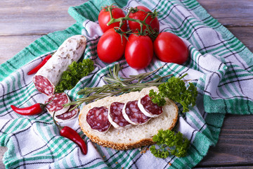 French salami with bread, tomatoes and parsley