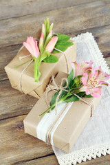 Obraz na płótnie Canvas Natural style handcrafted gift boxes with fresh plants and