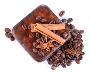 Organic soap with coffee beans and spices, isolated on white