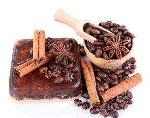 Organic soap with coffee beans and spices, isolated on white
