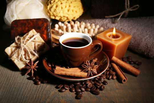 Cup with coffee drink, soap with coffee beans and spices,
