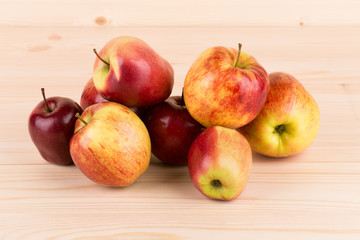 Fresh red apples on wood.