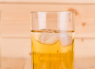 Close up of apple juice with ice.