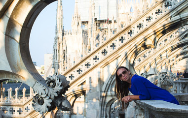 Beautiful woman on on the rooftop of Duomo, Milan, Italy