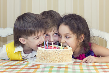 kids have fun eating birthday cake
