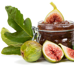 Fig jam in a preserving glass and fresh fruits with leaves