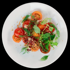 Appetizer with cherry tomatoes and smoked duck fillet