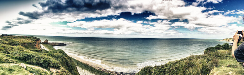 NORMANDY, FRANCE - MAY 20, 2014: Tourists visit the beaches famo