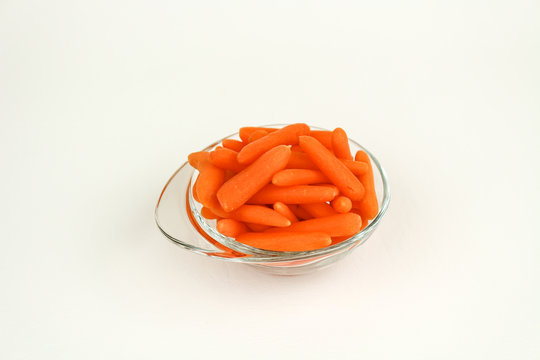fresh baby carrots in a bowl