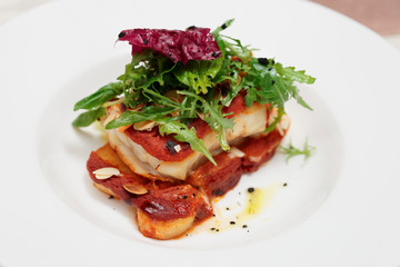 Fish and potatoes fried with romesco sauce