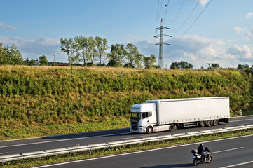 Corridor highway with white truck and motorcycle