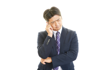 頭痛を訴えるビジネスマン