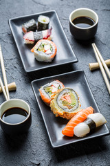 Sushi for two served in a black ceramic