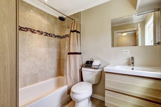 Bathroom with beige tile trim
