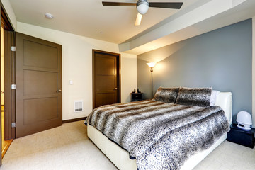 Modern white bed with leopard print bedding