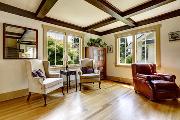 Sitting area with antique chairs and small table. Old fashion ho