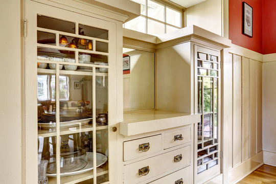 Antique storage combination with glass doors and drawers