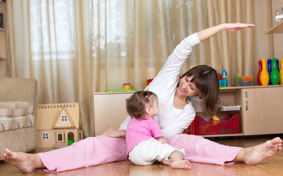 mother and kid doing gymnastic at home