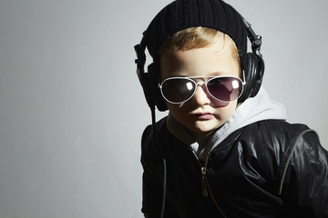 little DJ.funny boy in sunglasses and headphones.music deejay