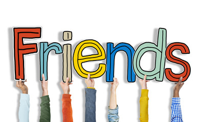 Multiethnic Group of Hands Holding Word Friends