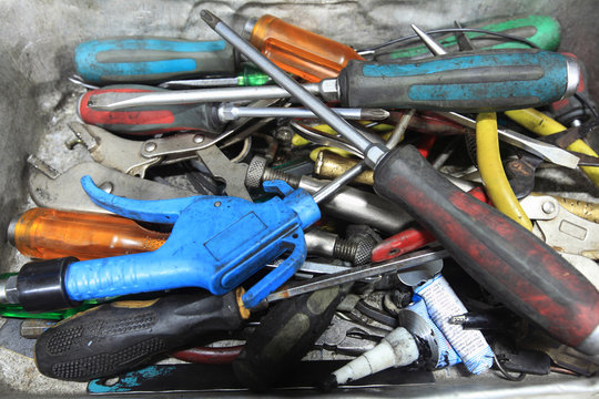 Many hand tools in car garage