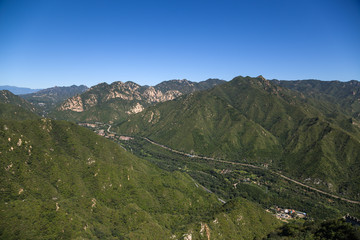 Fototapeta na wymiar Mountain landscape. In the background is the Great Wall of China
